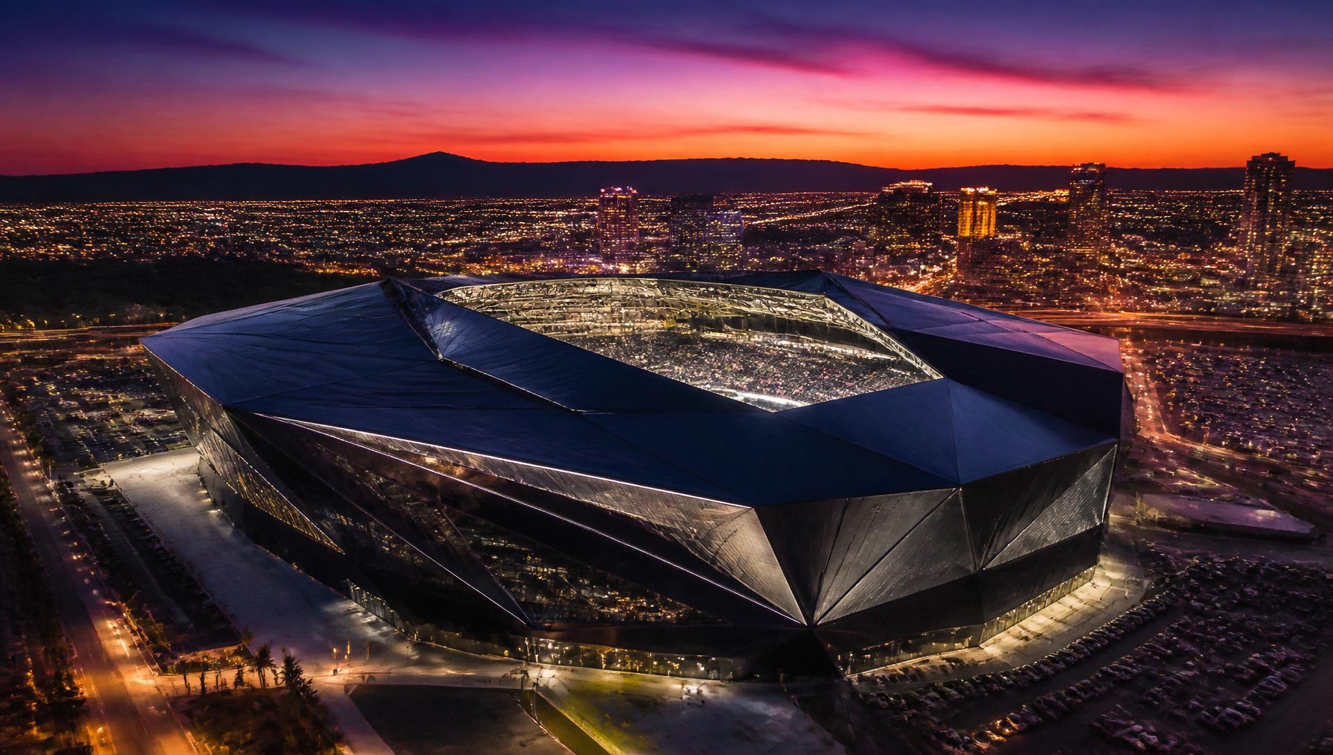 Aerial view of a modern stadium at sunset