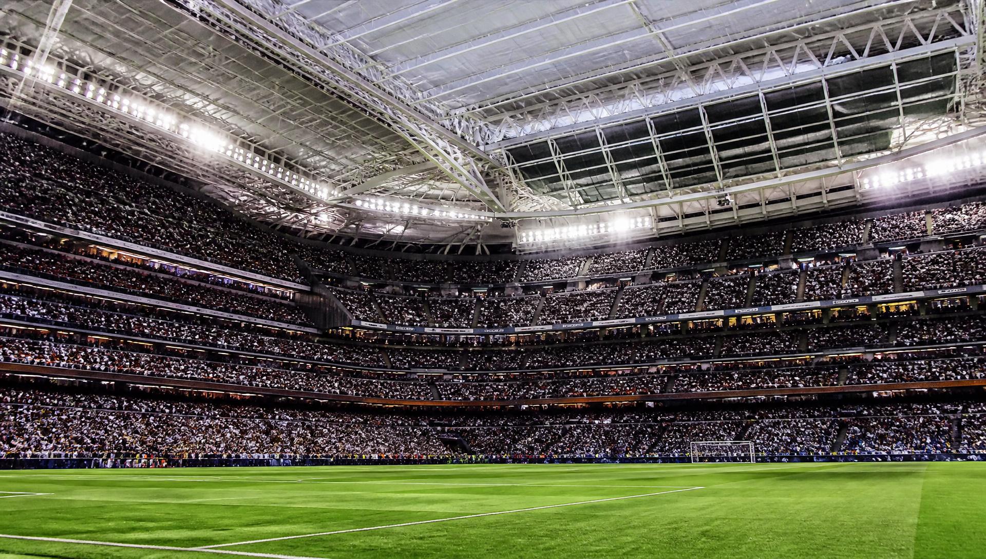 Iconic stadium interior with closed roof and fans